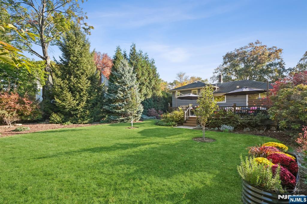 398 Grove Street Montclair, NJ 07043 - Photo 31 of 48 a front view of a house with garden