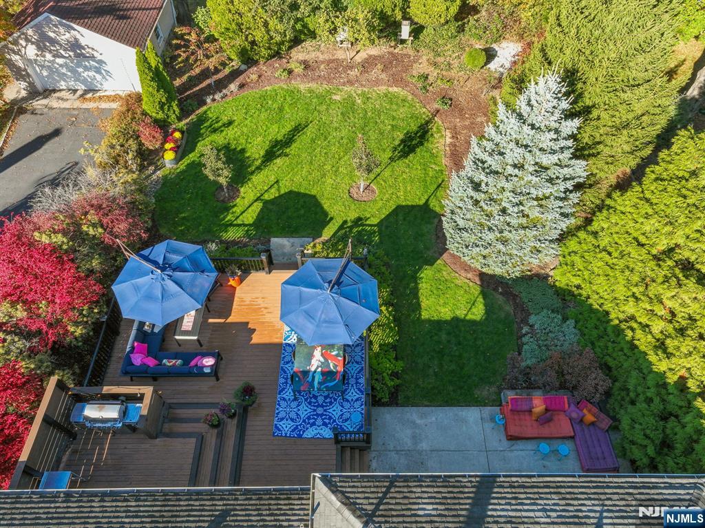 398 Grove Street Montclair, NJ 07043 - Photo 34 of 48 a bath room with lots of flowers and a tree