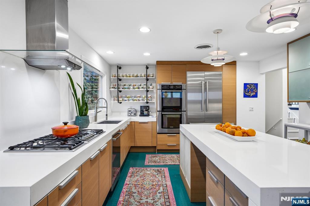 398 Grove Street Montclair, NJ 07043 - Photo 8 of 48 a kitchen with stainless steel appliances granite countertop a sink stove and refrigerator
