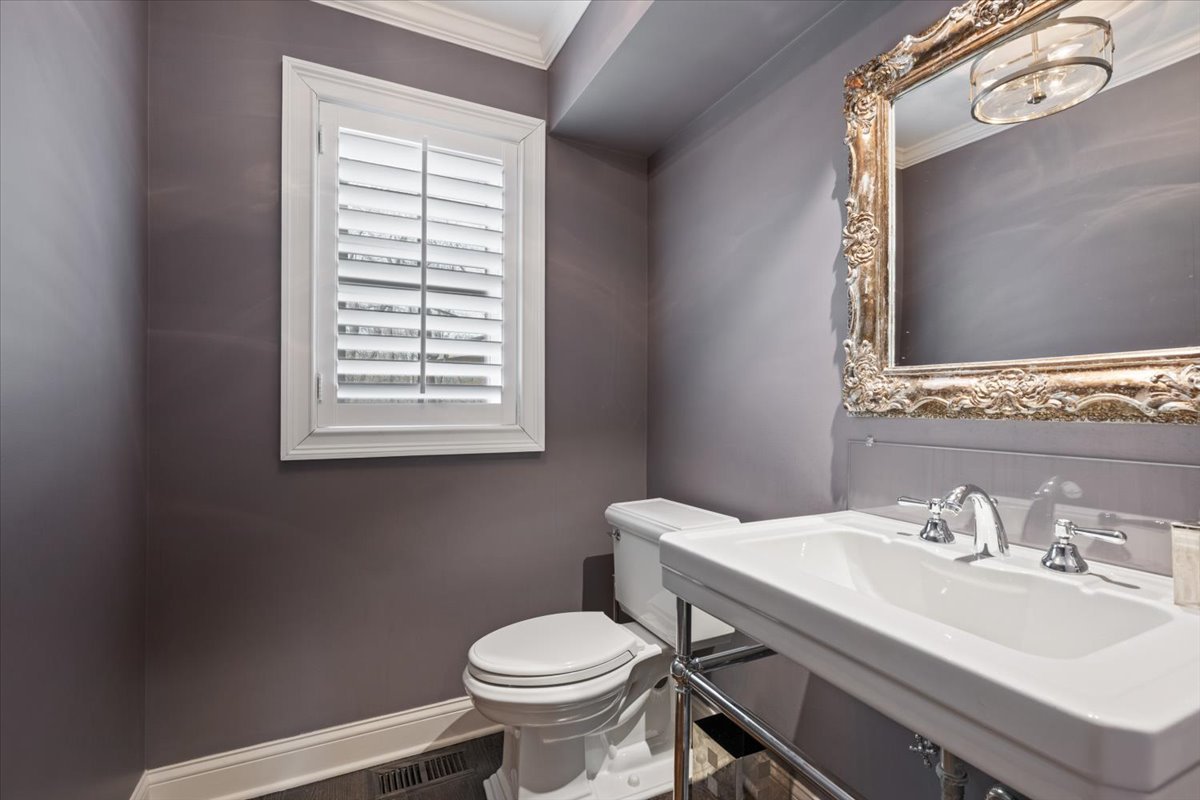 1588 White Oak Road Lake Forest, IL 60045 - Photo 11 of 35 a bathroom with a sink a toilet and a mirror