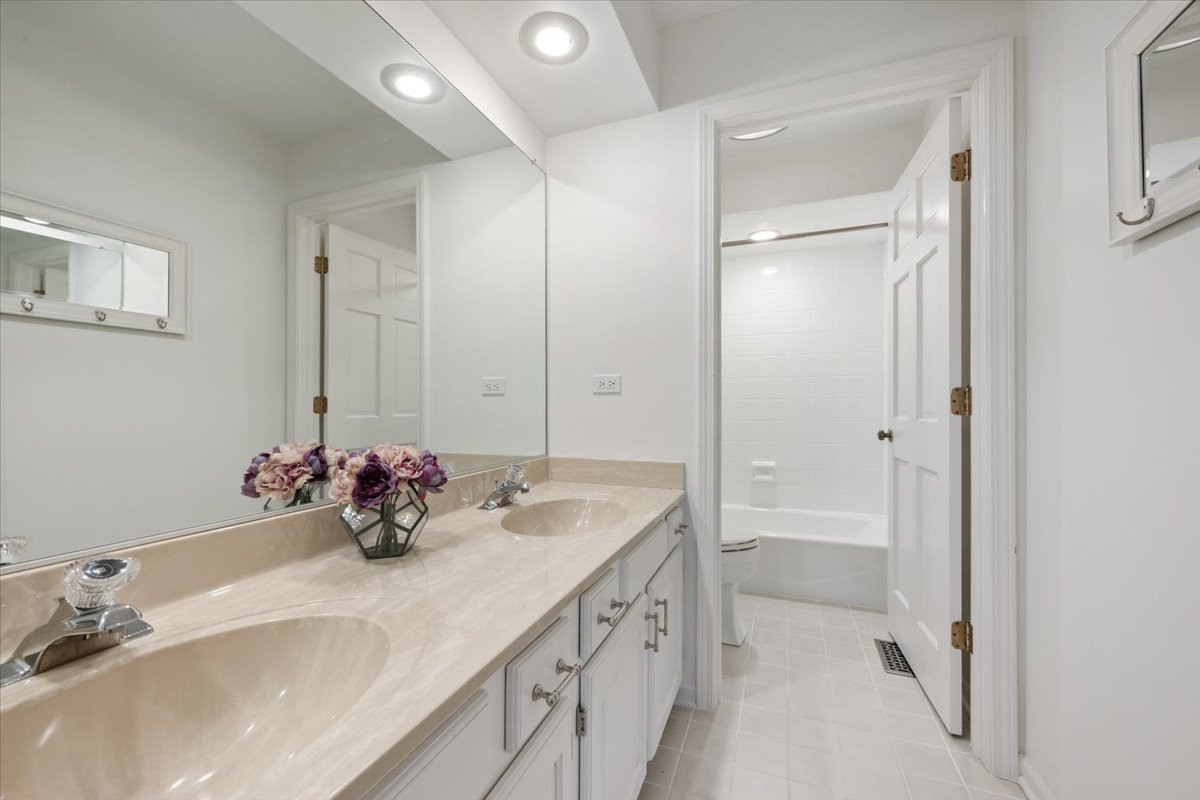 1588 White Oak Road Lake Forest, IL 60045 - Photo 19 of 35 a bathroom with a sink vanity tub and shower