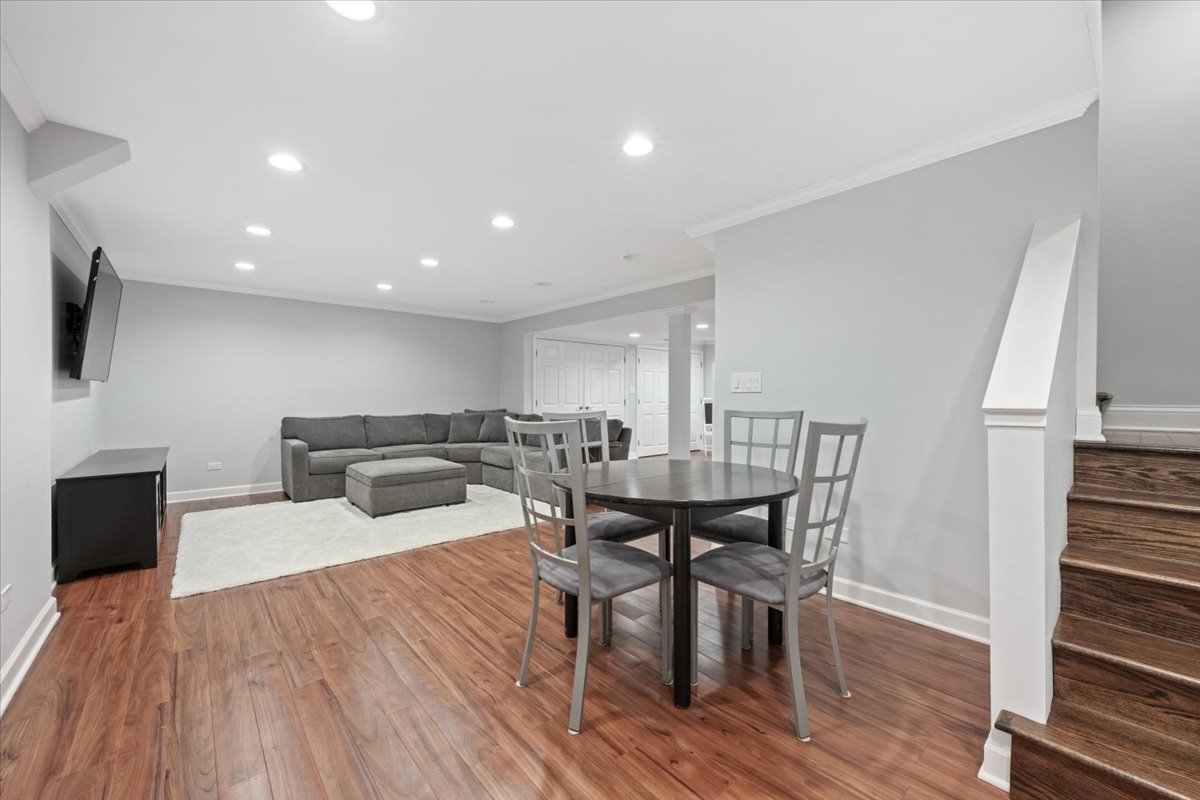 1588 White Oak Road Lake Forest, IL 60045 - Photo 20 of 35 a view of a dining room with furniture wooden floor and a rug