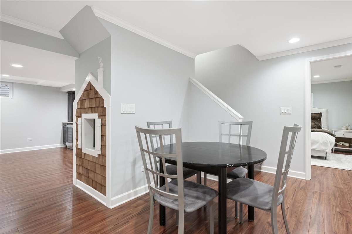 1588 White Oak Road Lake Forest, IL 60045 - Photo 24 of 35 a view of a dining room with furniture and wooden floor