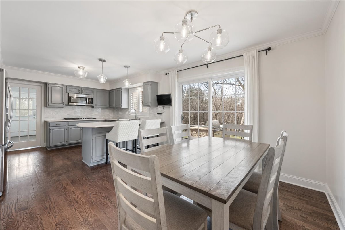 1588 White Oak Road Lake Forest, IL 60045 - Photo 10 of 35 a kitchen with stainless steel appliances granite countertop a stove oven a sink dishwasher and white cabinets with wooden floor