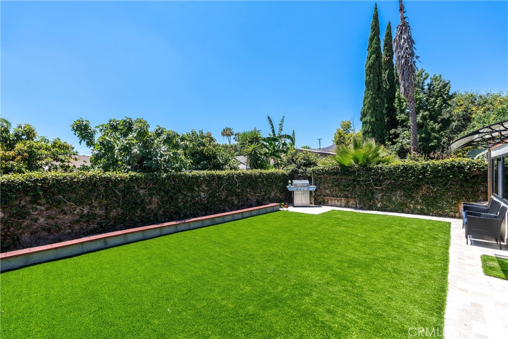 11520 Los Molinos Way Riverside, CA 92505 - Photo 24 of 26 a view of a garden with a building in the background