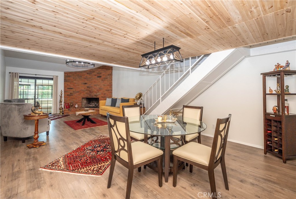 11520 Los Molinos Way Riverside, CA 92505 - Photo 5 of 26 a view of a dining room with furniture and wooden floor