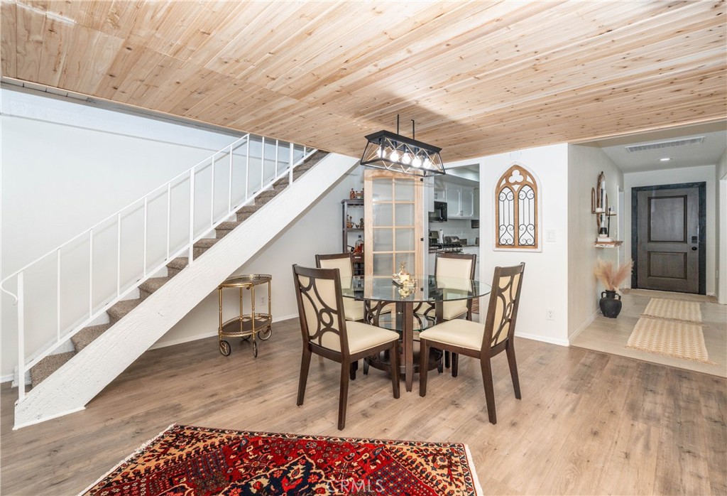 11520 Los Molinos Way Riverside, CA 92505 - Photo 6 of 26 a dining room with furniture and wooden floor