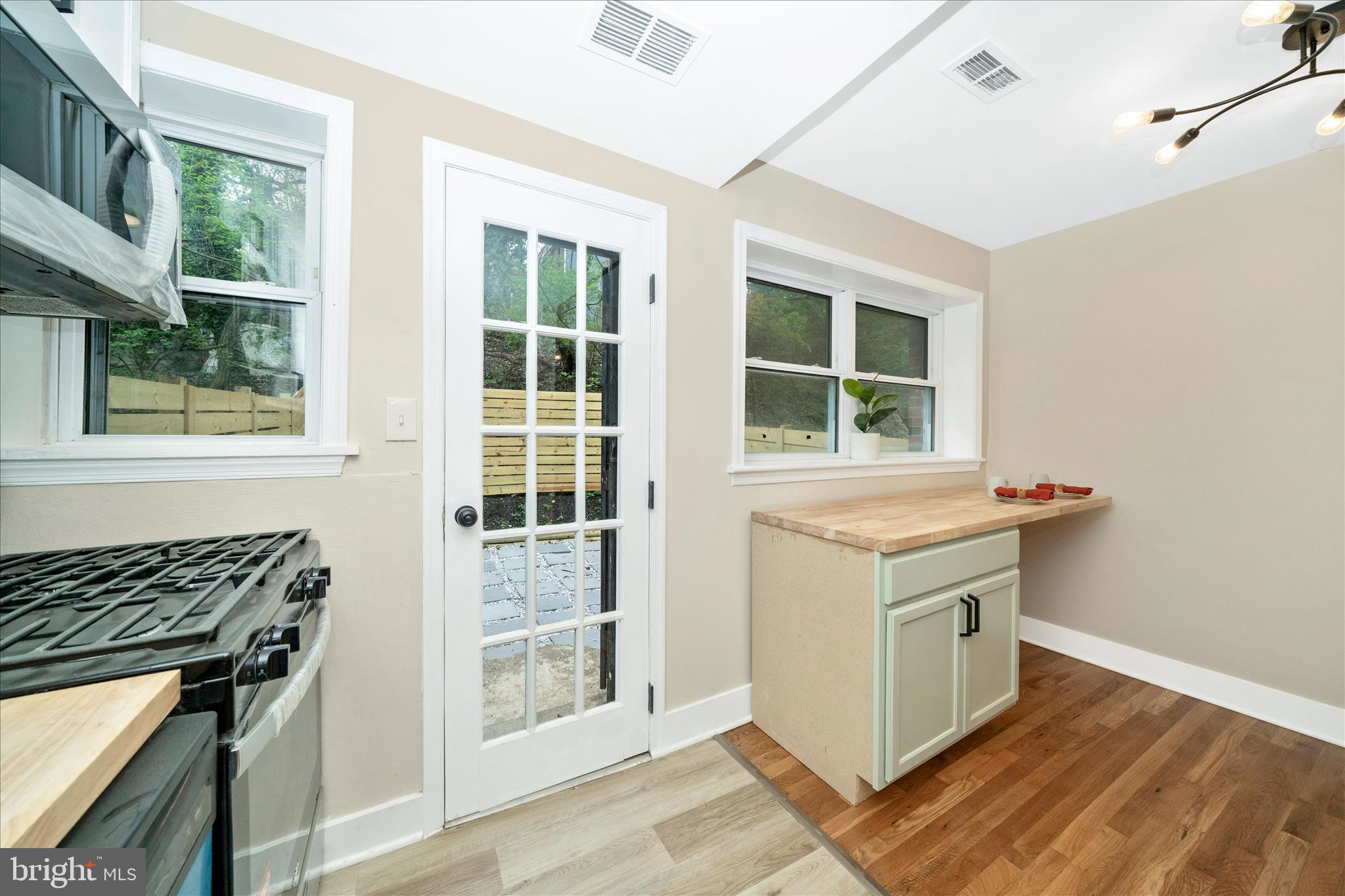 5045 Sheriff Road Northeast Washington, DC 20019 - Photo 13 of 38 a kitchen with a stove and a window