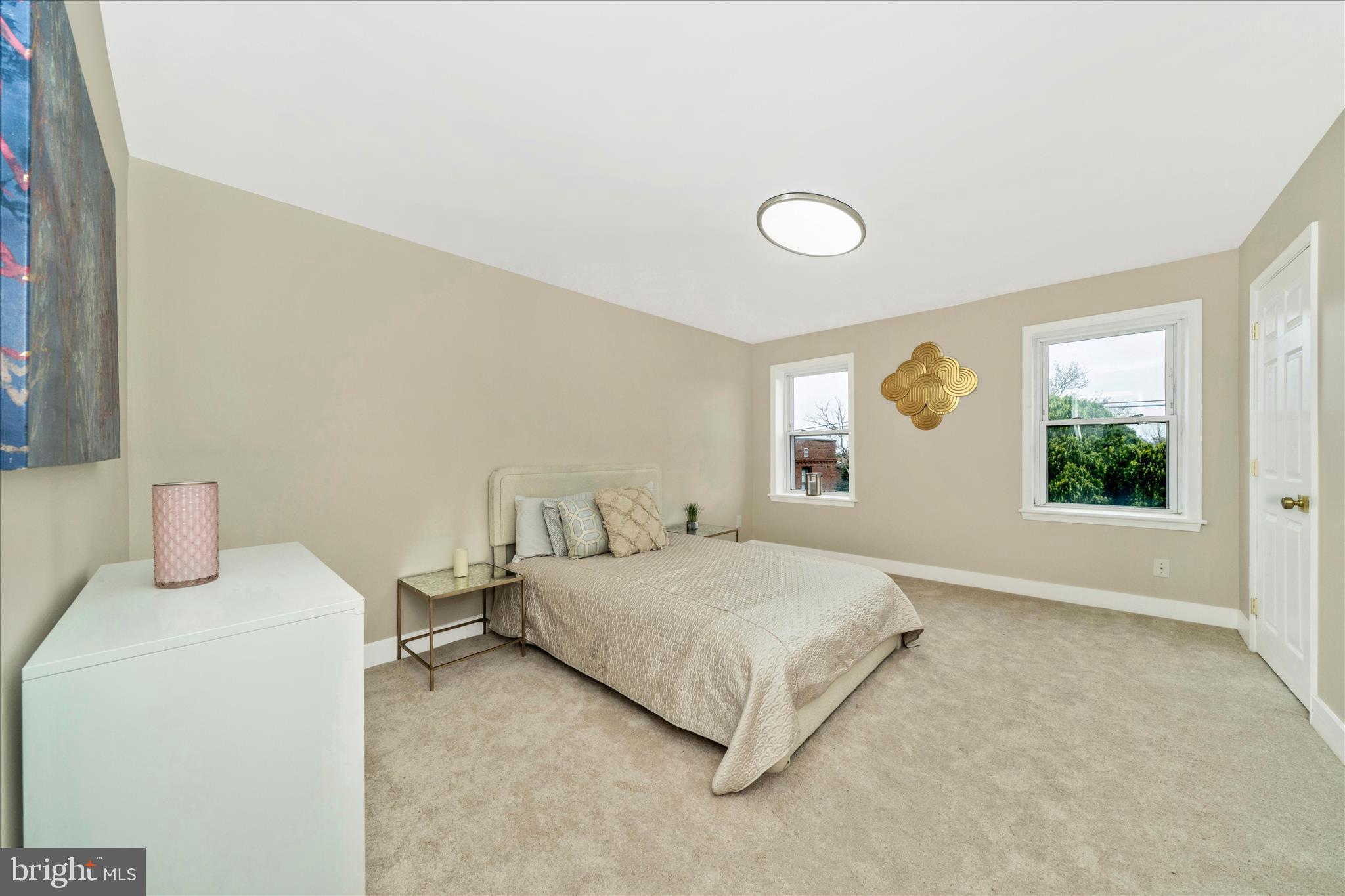 5045 Sheriff Road Northeast Washington, DC 20019 - Photo 15 of 38 a bedroom with a bed and a window