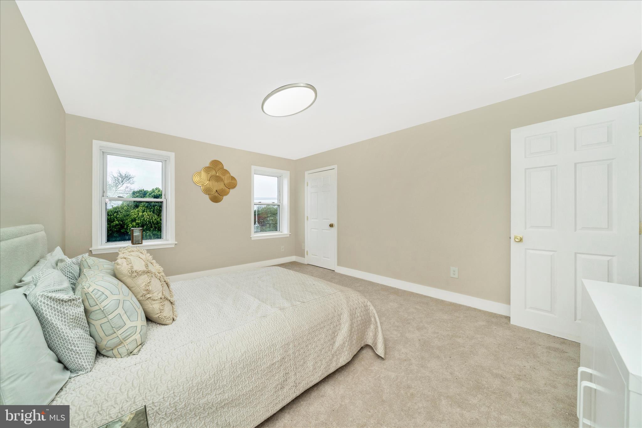 5045 Sheriff Road Northeast Washington, DC 20019 - Photo 16 of 38 a bedroom with a bed and window