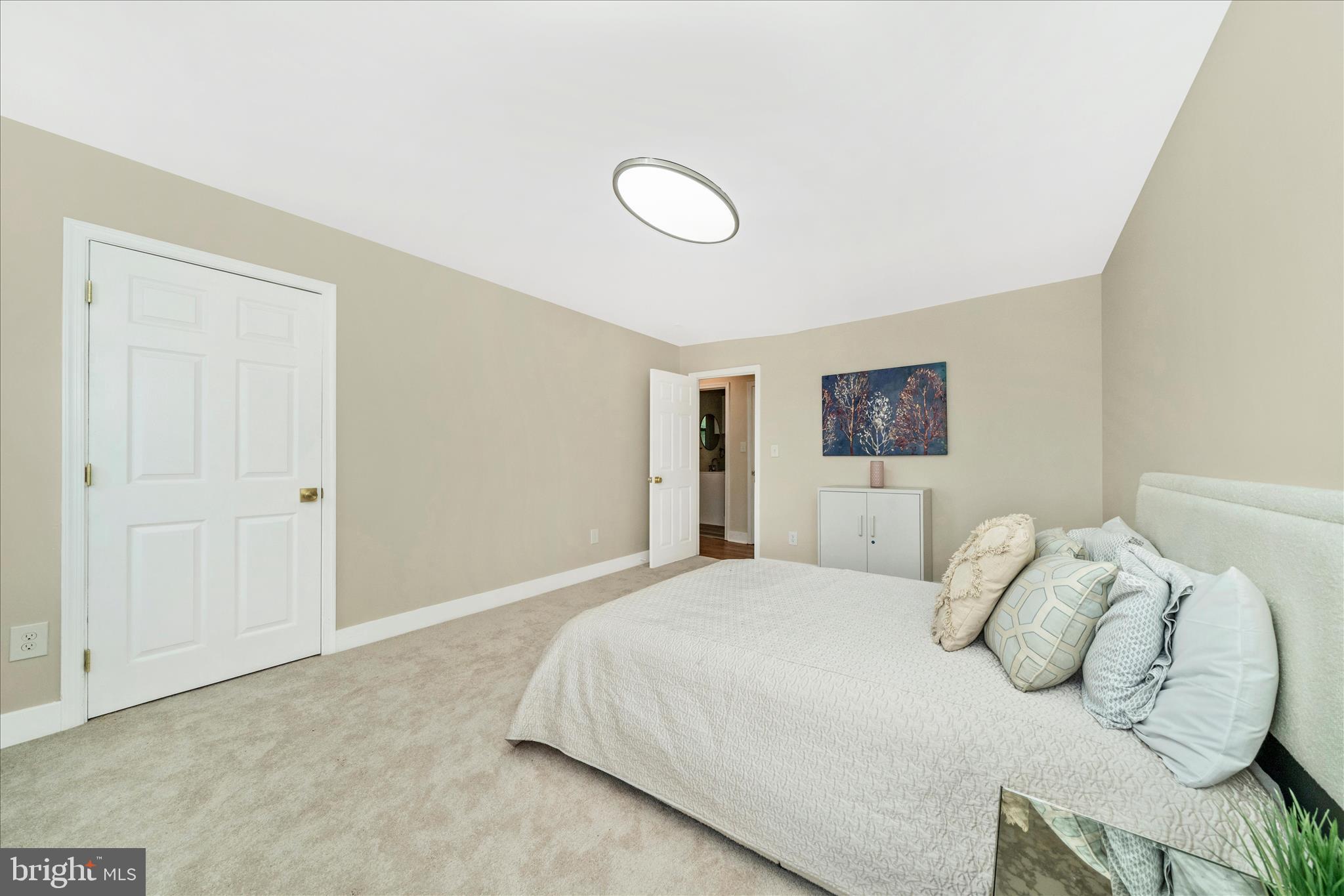 5045 Sheriff Road Northeast Washington, DC 20019 - Photo 18 of 38 a bedroom with a bed and a night stand