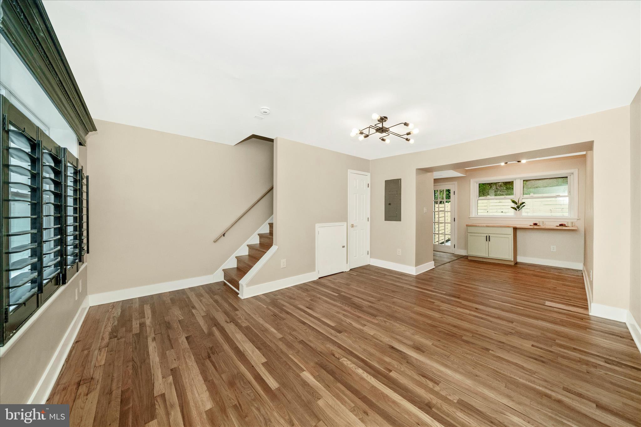 5045 Sheriff Road Northeast Washington, DC 20019 - Photo 2 of 38 a view of an empty room with wooden floor and a window