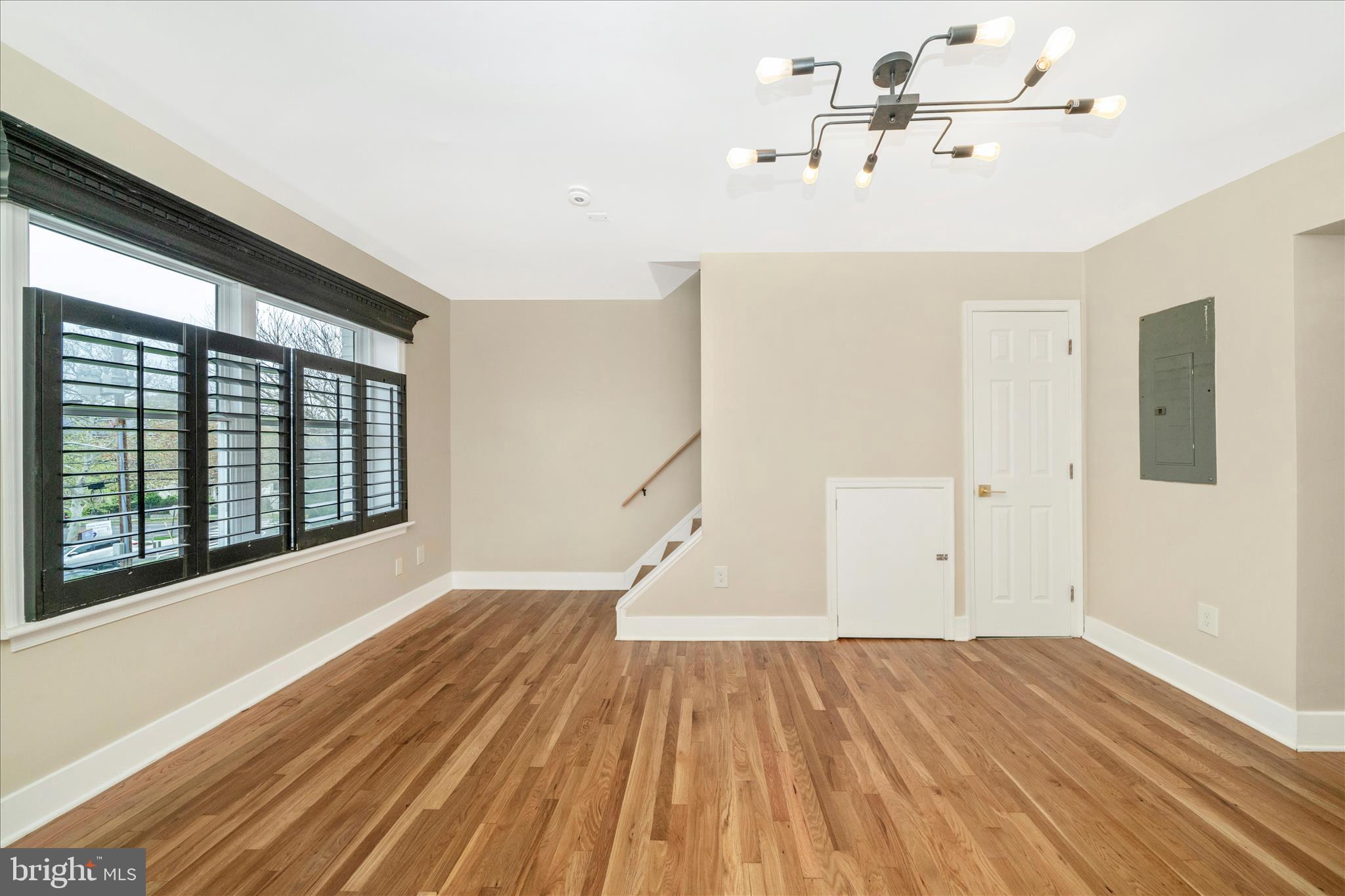 5045 Sheriff Road Northeast Washington, DC 20019 - Photo 6 of 38 a view of empty room with wooden floor and fan