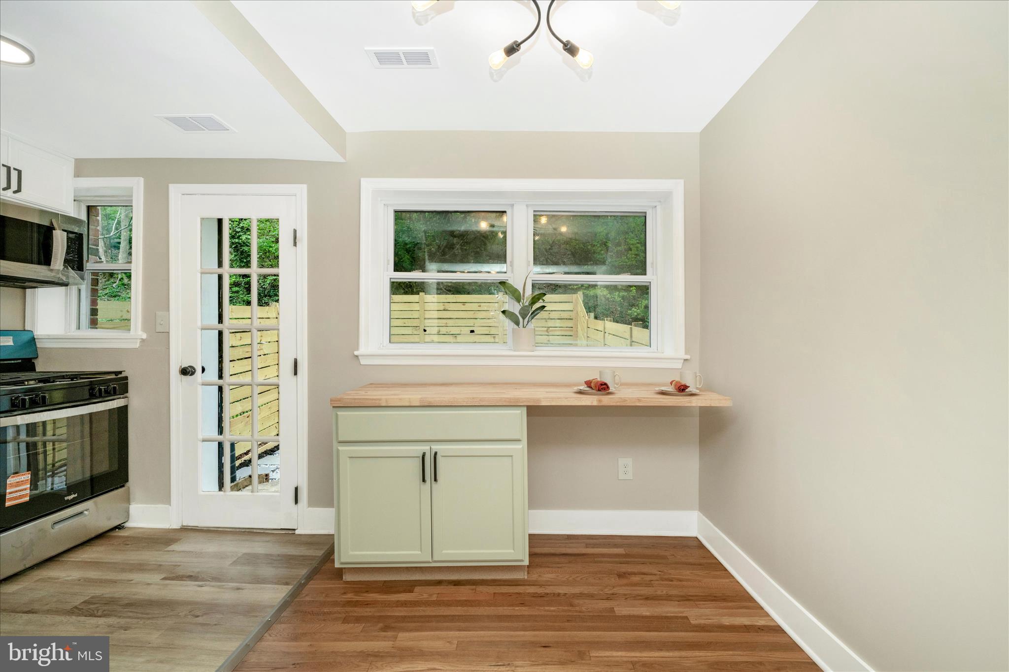 5045 Sheriff Road Northeast Washington, DC 20019 - Photo 9 of 38 a view of a kitchen with a sink hardwood floor and a window