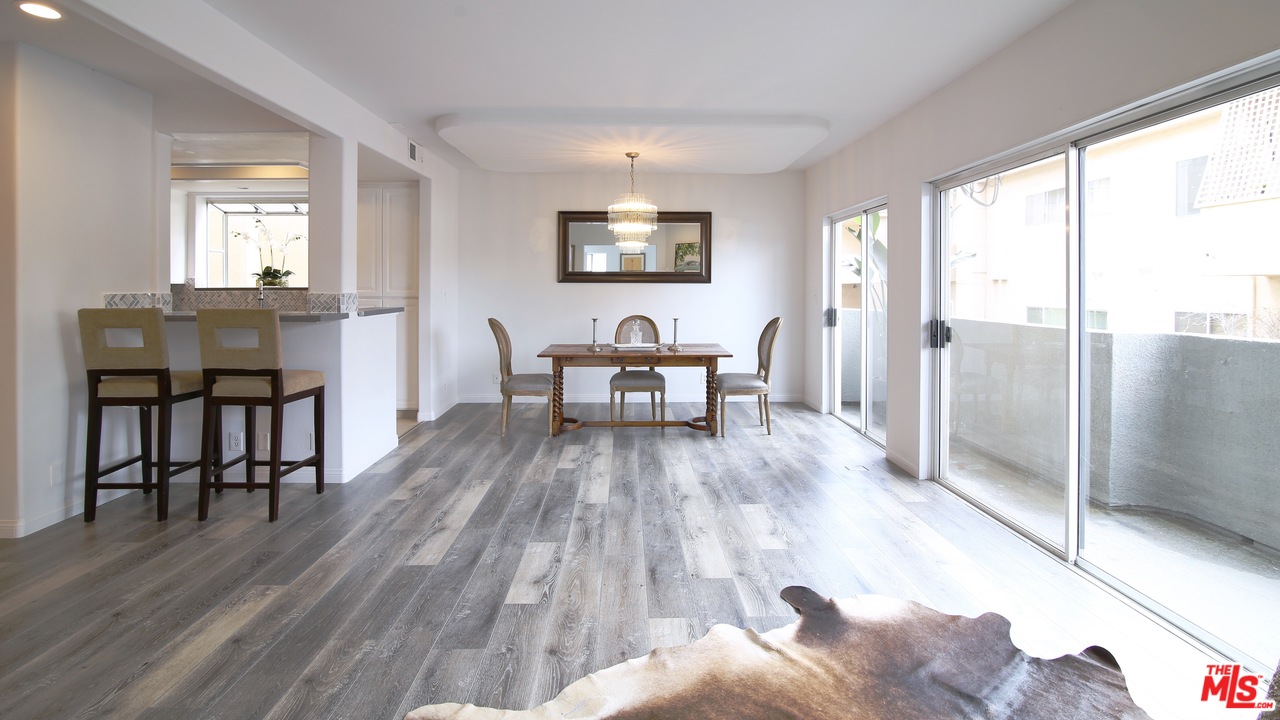 1811 Manning Avenue, Unit 202 Los Angeles, CA 90025 - Photo 2 of 18 a living room with furniture and a wooden floor