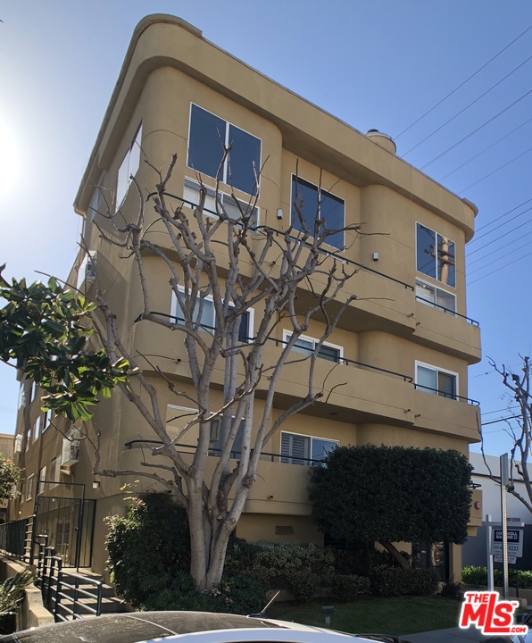 1811 Manning Avenue, Unit 202 Los Angeles, CA 90025 - Photo 18 of 18 a front view of a house with parking space