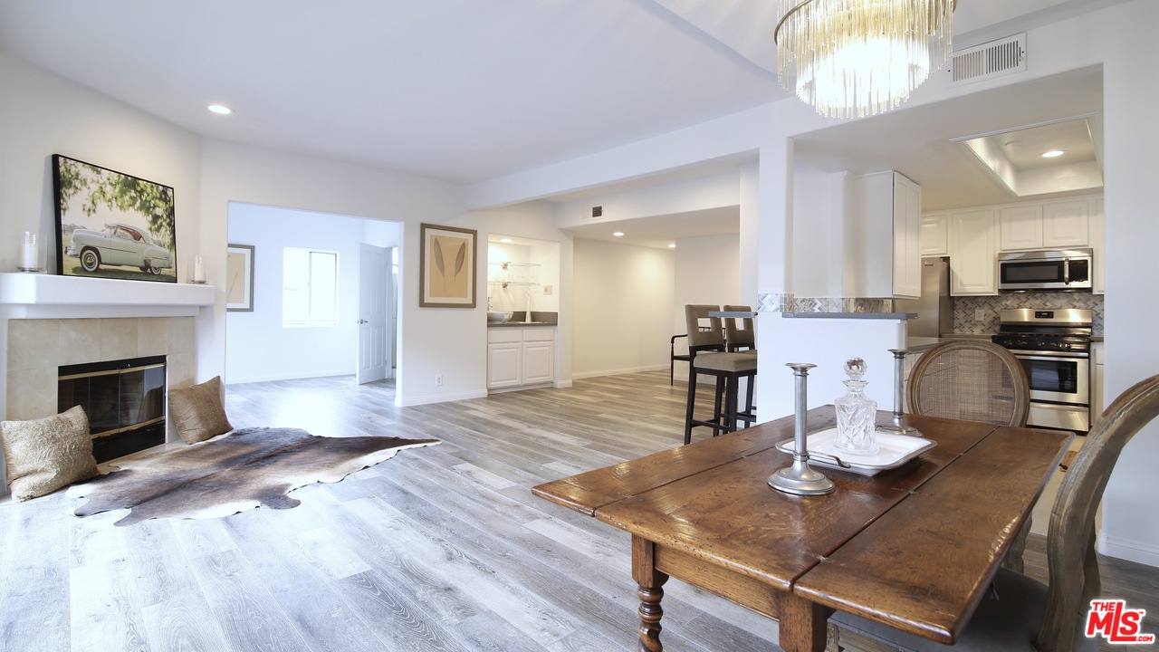 1811 Manning Avenue, Unit 202 Los Angeles, CA 90025 - Photo 3 of 18 a living room with furniture and a fireplace