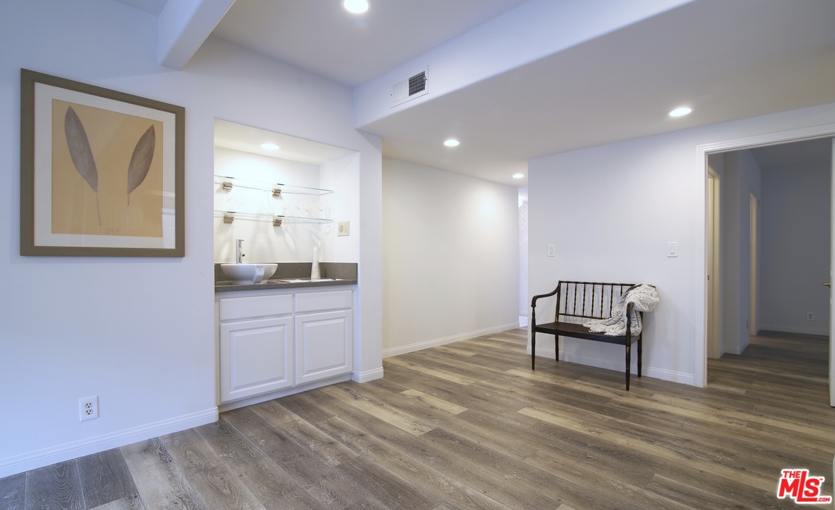 1811 Manning Avenue, Unit 202 Los Angeles, CA 90025 - Photo 7 of 18 a view of kitchen with wooden floor and electronic appliances