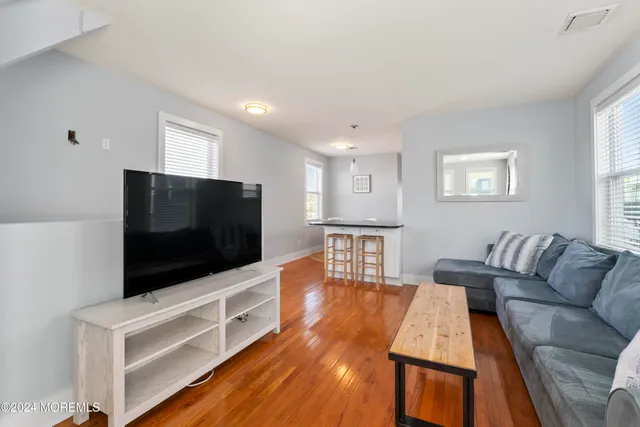 a bathroom with a shower a toilet and sink