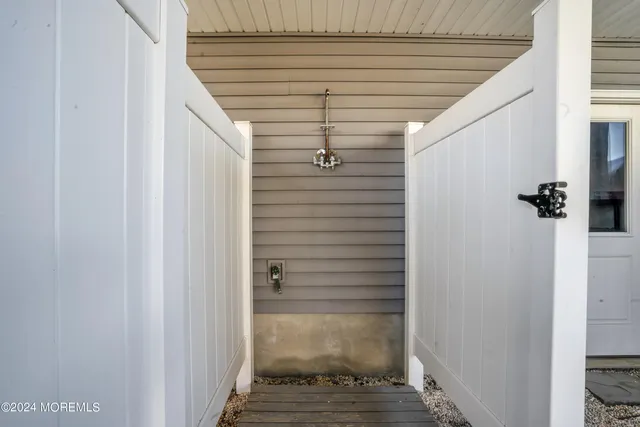 a view of a house with wooden fence