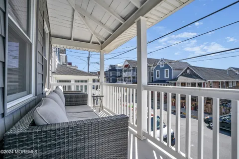 a view of a balcony with furniture