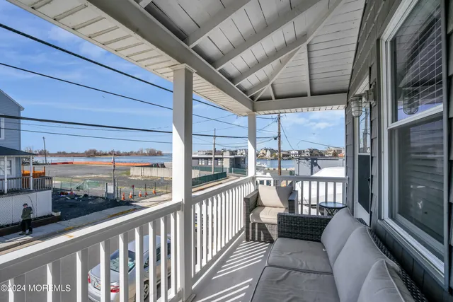 a kitchen with granite countertop a stove top oven microwave and cabinets