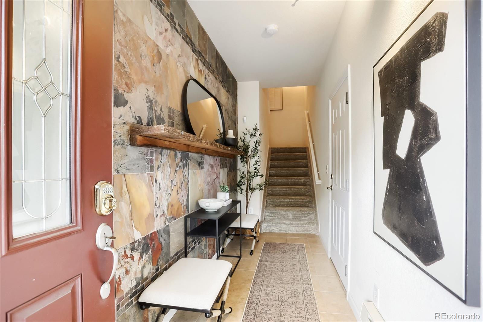 6232 Kilmer Loop, Unit 203 Golden, CO 80403 - Photo 6 of 33 a view of an entryway with wooden floor and door