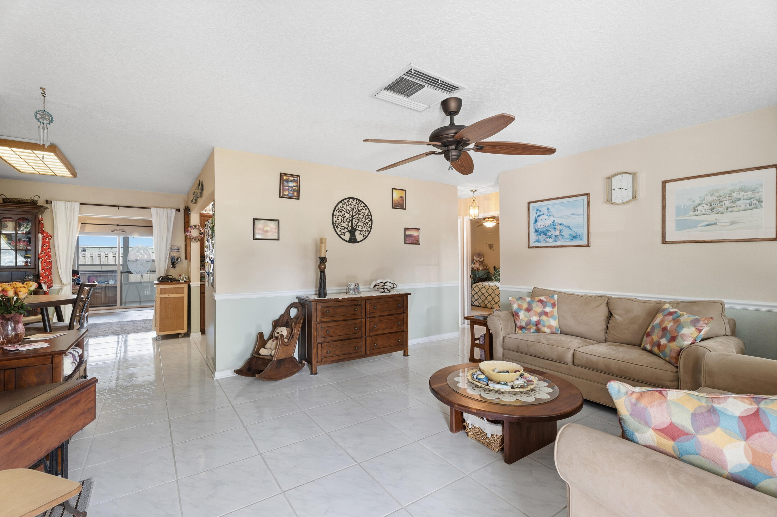 1341 Southeast Seashell Lane Stuart, FL 34996 - Photo 4 of 24 a living room with furniture and a large window