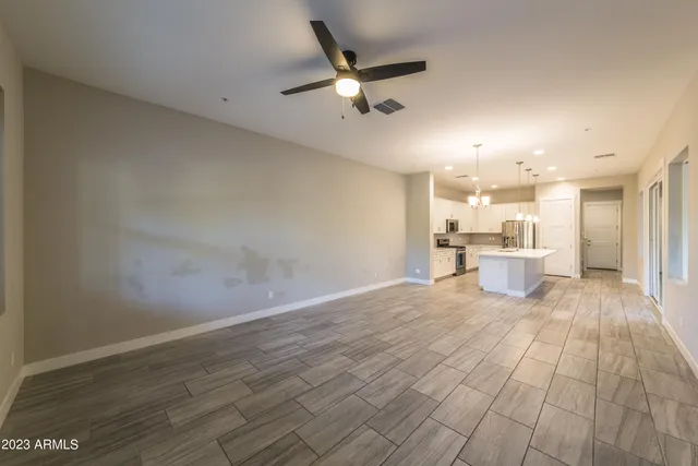a view of a kitchen with a dishwasher and wooden floor