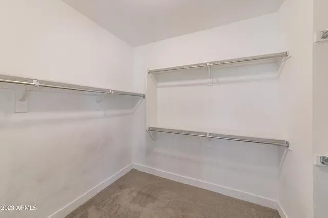 a view of an empty walk in closet