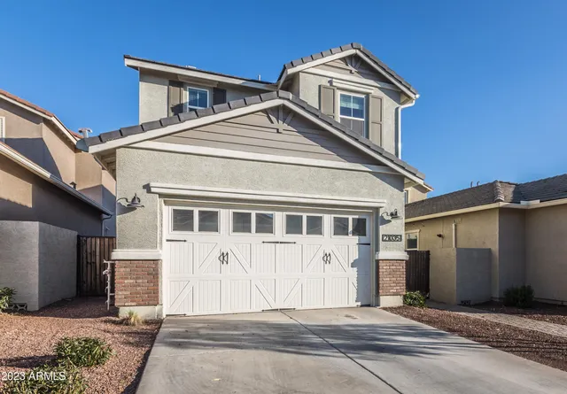 a front view of a house with a garage
