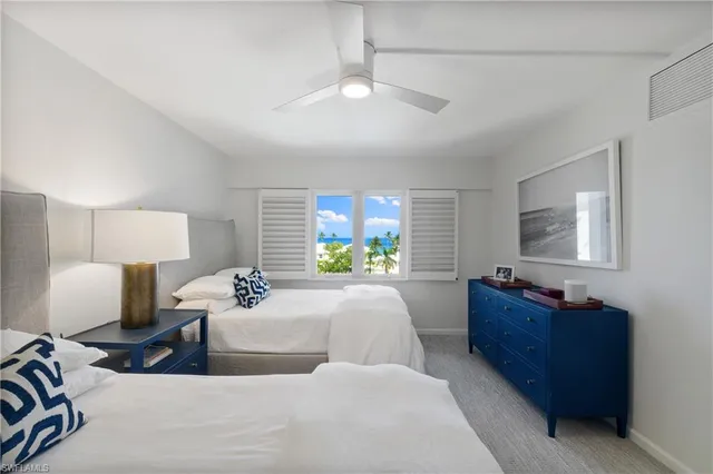 a bed room with bed and a window