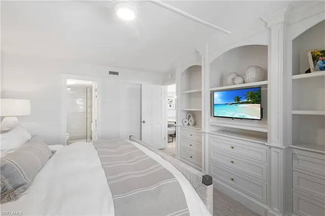 a bedroom with a bed and a dresser