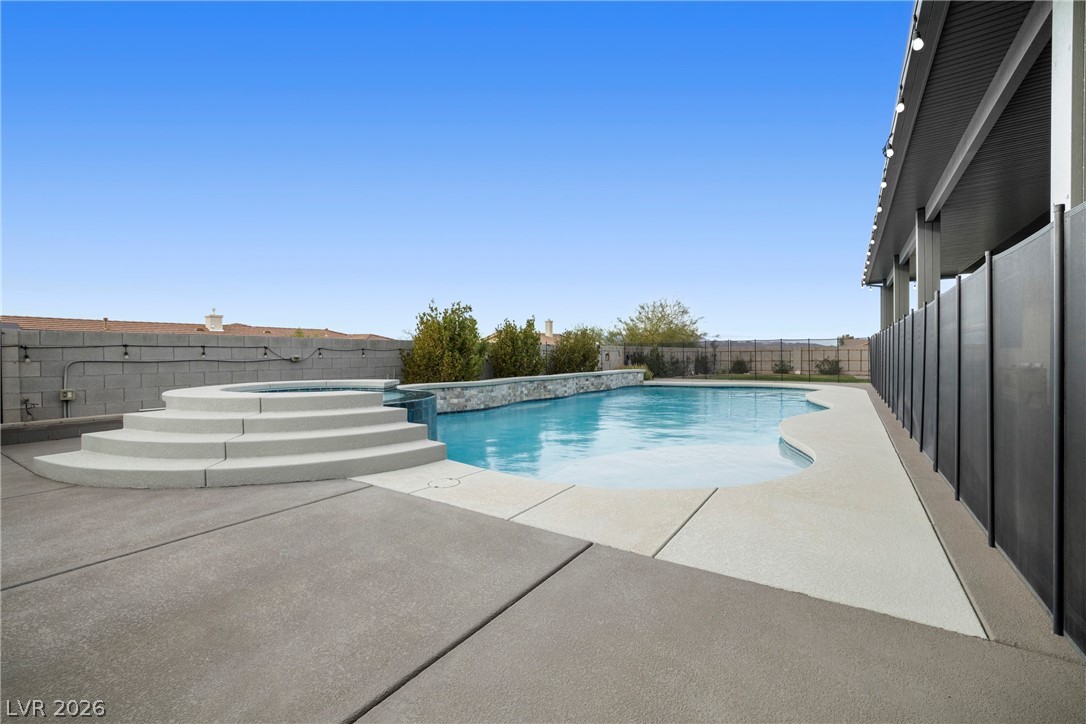 432 North Racetrack Road Henderson, NV 89015 - Photo 39 of 45 Combined pool / hot tub featuring a patio area and a fenced backyard