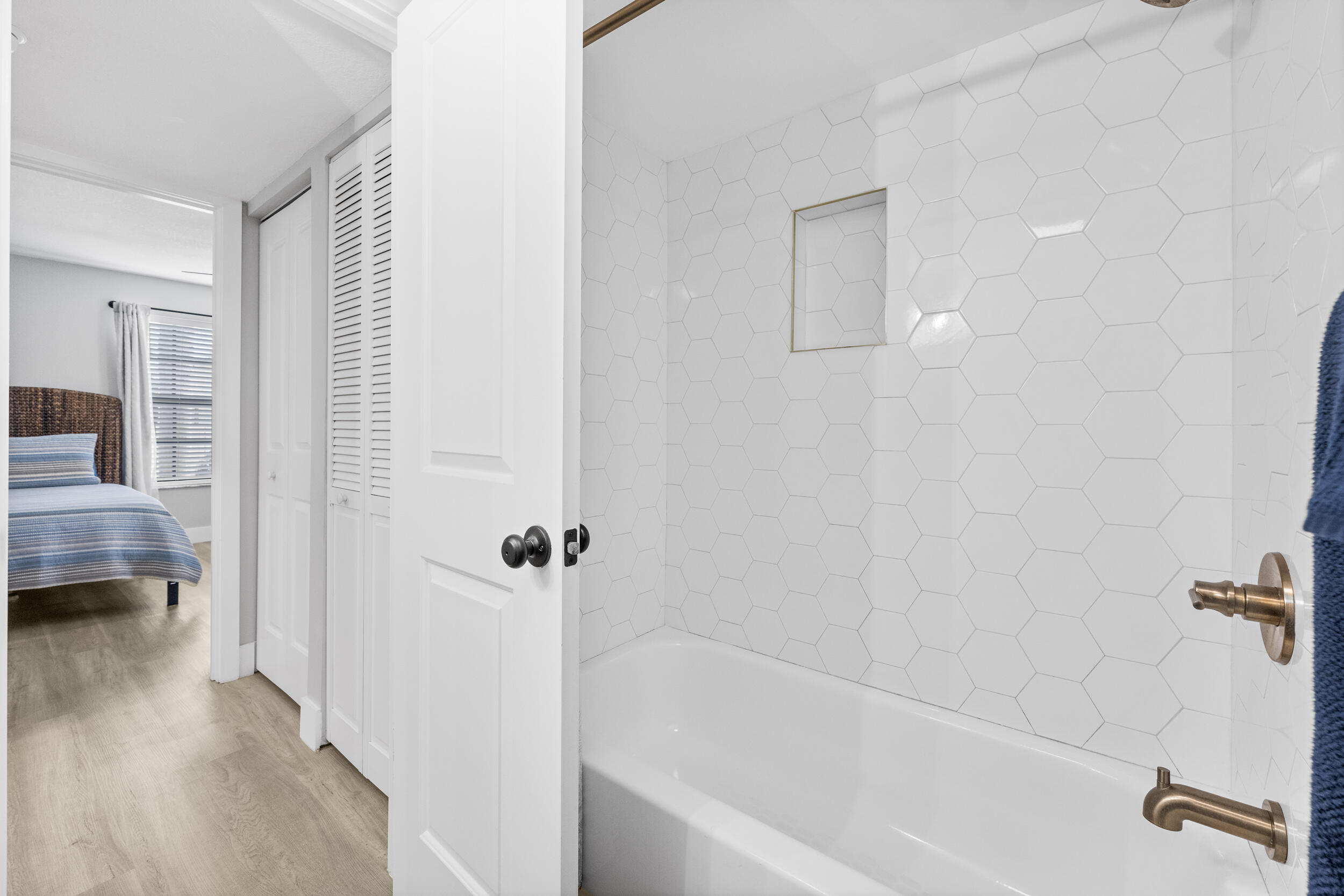 17867 Thelma Avenue, Unit A Jupiter, FL 33458 - Photo 18 of 35 a bathroom with a bathtub and a shower