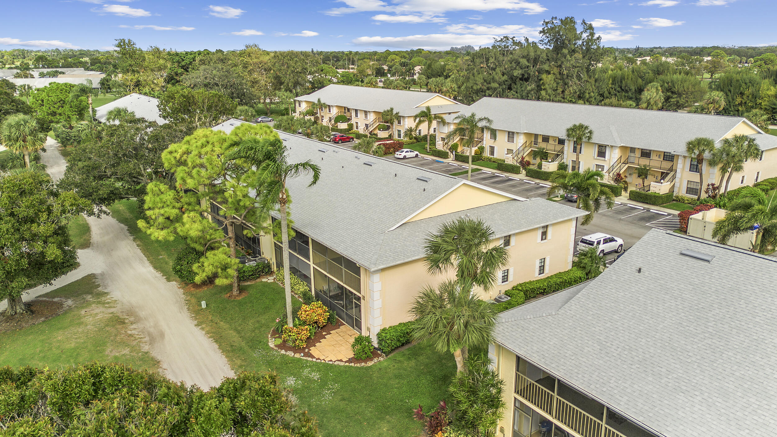 17867 Thelma Avenue, Unit A Jupiter, FL 33458 - Photo 31 of 35 an aerial view of a house with yard swimming pool and outdoor seating