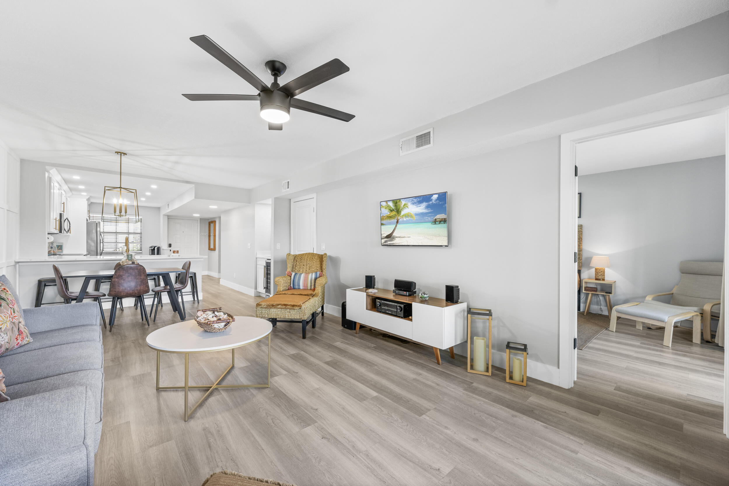 17867 Thelma Avenue, Unit A Jupiter, FL 33458 - Photo 9 of 35 a living room with furniture and a wooden floor