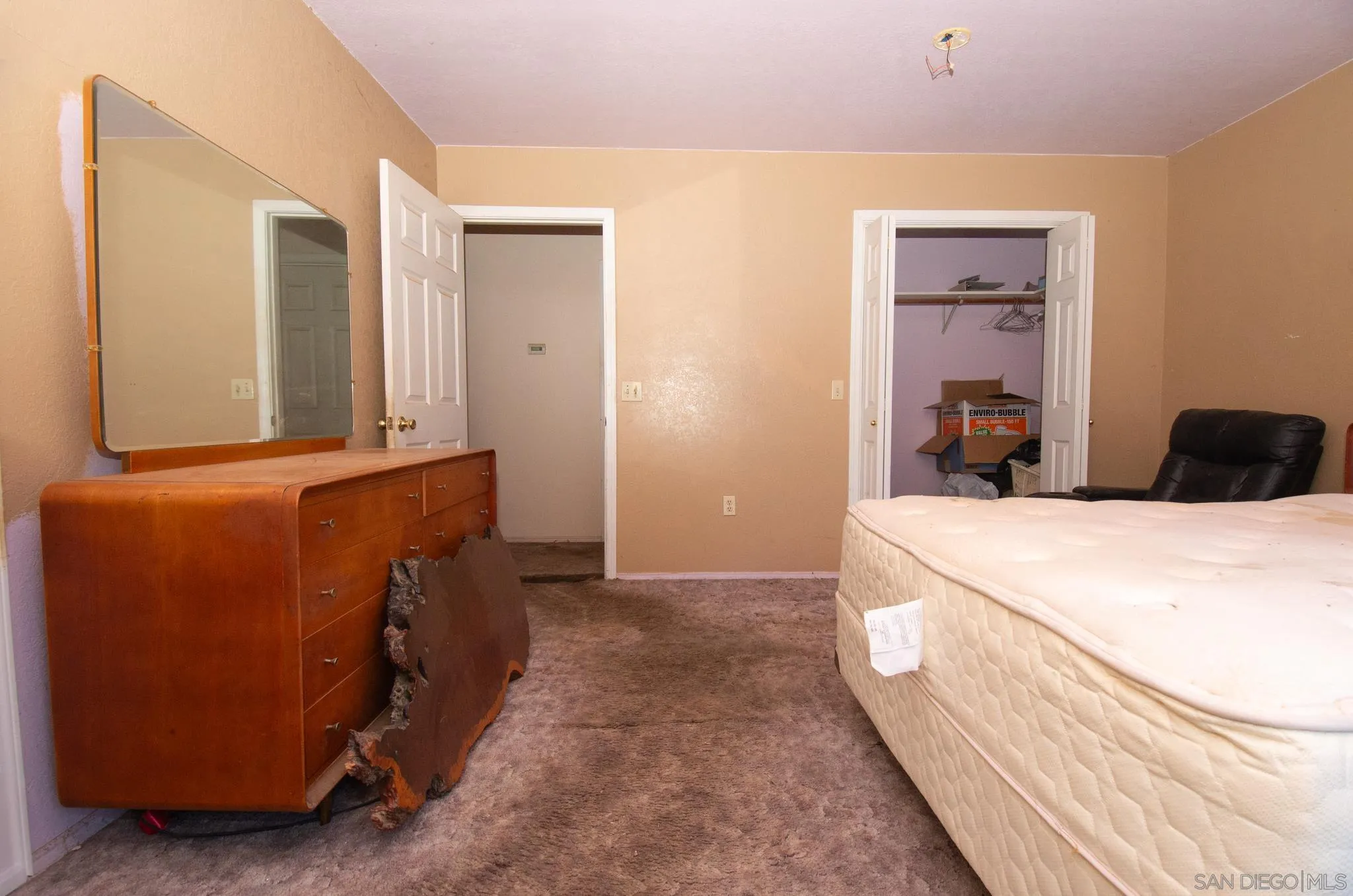 9897 Dyerville Loop Road Myers Flat, CA 95554 - Photo 14 of 24 a bedroom with a bed and a cabinets