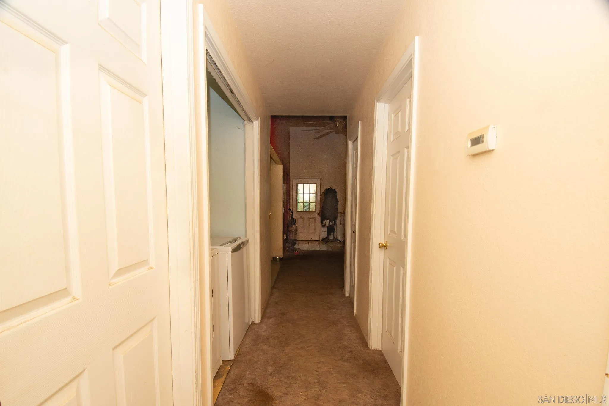 9897 Dyerville Loop Road Myers Flat, CA 95554 - Photo 20 of 24 a view of a hallway with wooden shelves