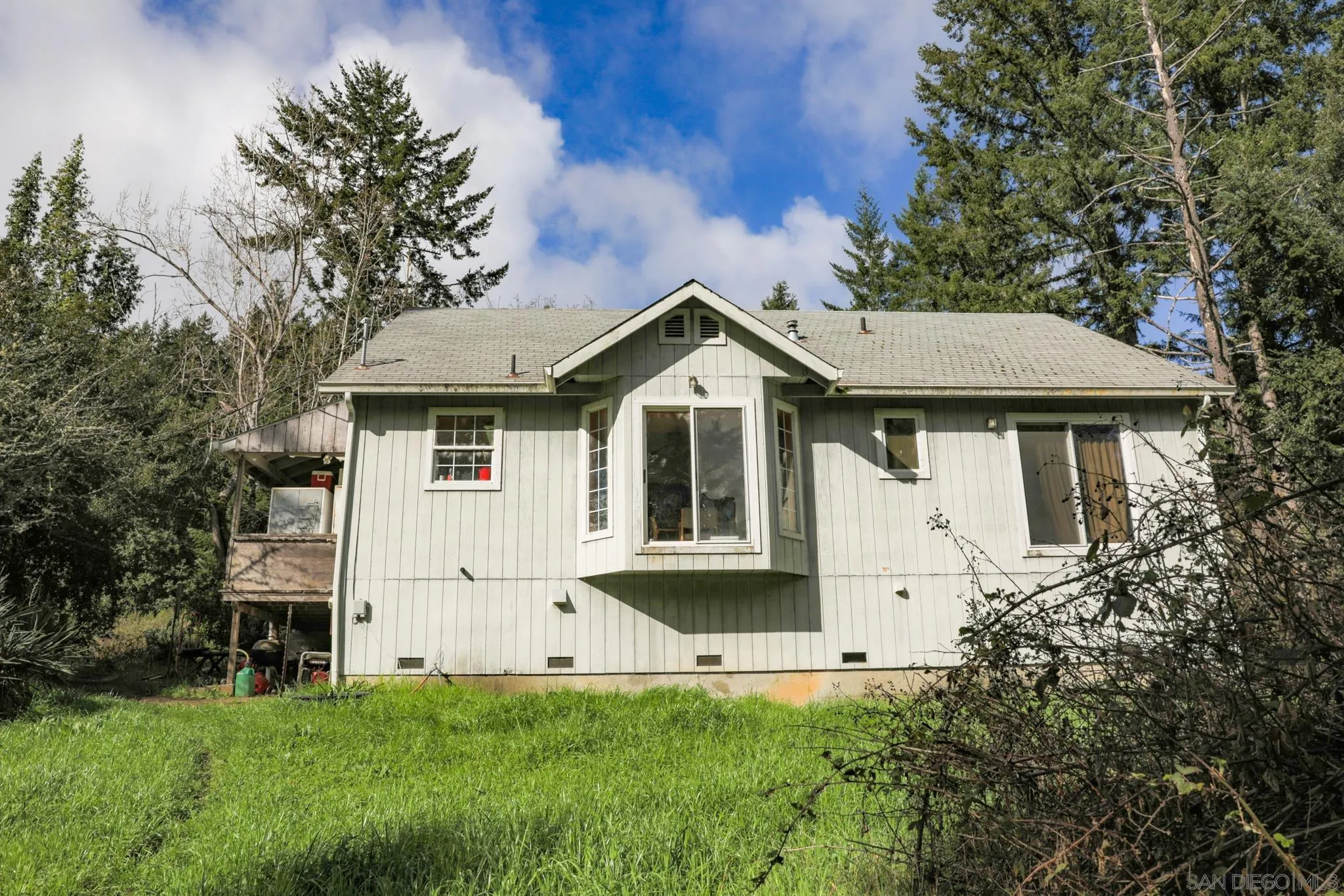 9897 Dyerville Loop Road Myers Flat, CA 95554 - Photo 7 of 24 a front view of a house with a yard