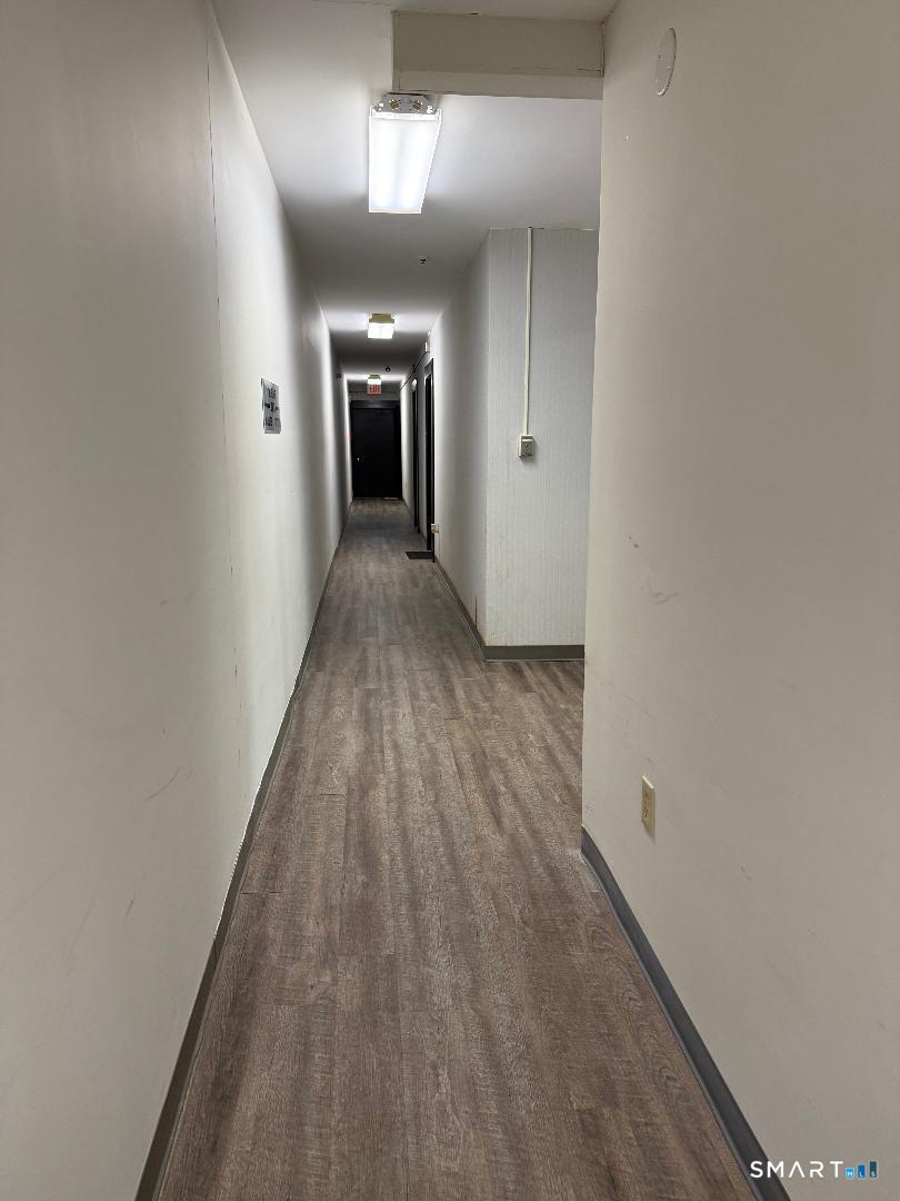 1 Beaver Brook Road, Unit 29 Danbury, CT 06810 - Photo 2 of 16 wooden floor in a hall with an entryway