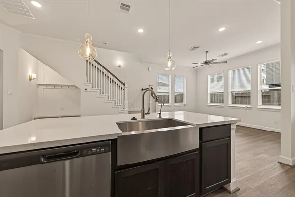 a kitchen with a sink and cabinets