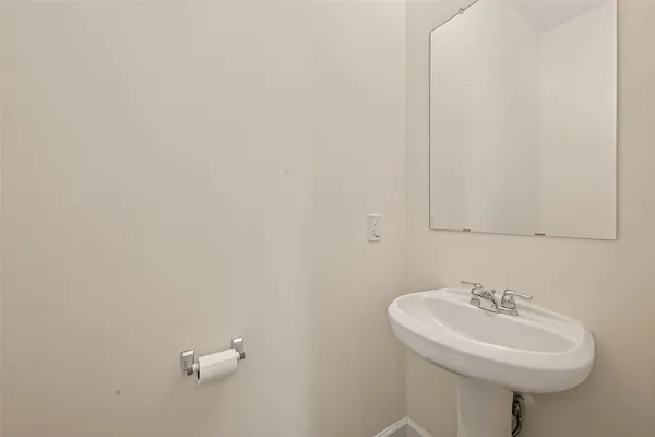 a bathroom with a sink and mirror
