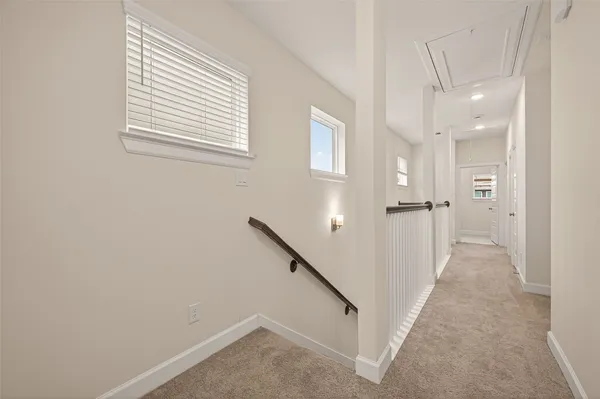 a view of a hallway with a white walls