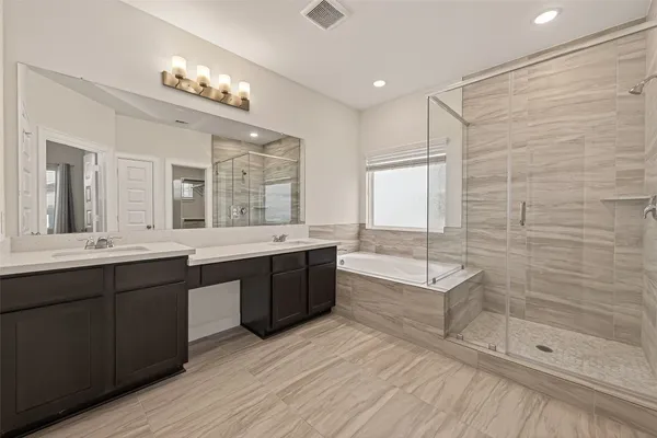 a bathroom with a bathtub and a sink