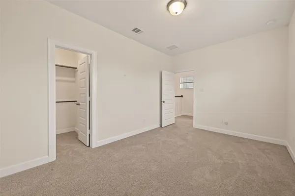 a bathroom with a sink a toilet and shower curtain