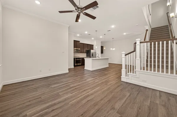 a view of a kitchen with a sink and a window