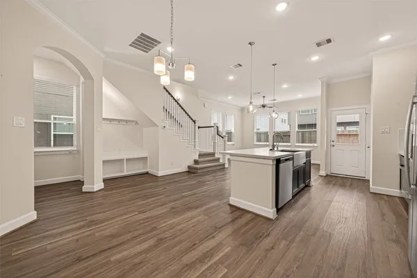 a view of kitchen with cabinets and wooden floor