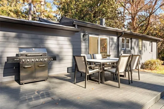 a view of a patio with a table and chairs
