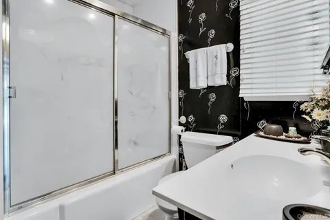 a bathroom with a sink and mirror